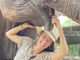 girl smiling with elephant